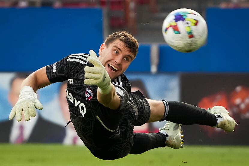 FC Dallas goalkeeper Maarten Paes dives for a shot that went wide of the net during the...