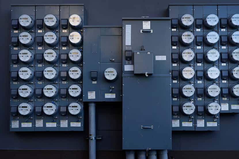 Rows of apartment electrical meters line the wall near downtown Dallas, Wednesday, June 30,...
