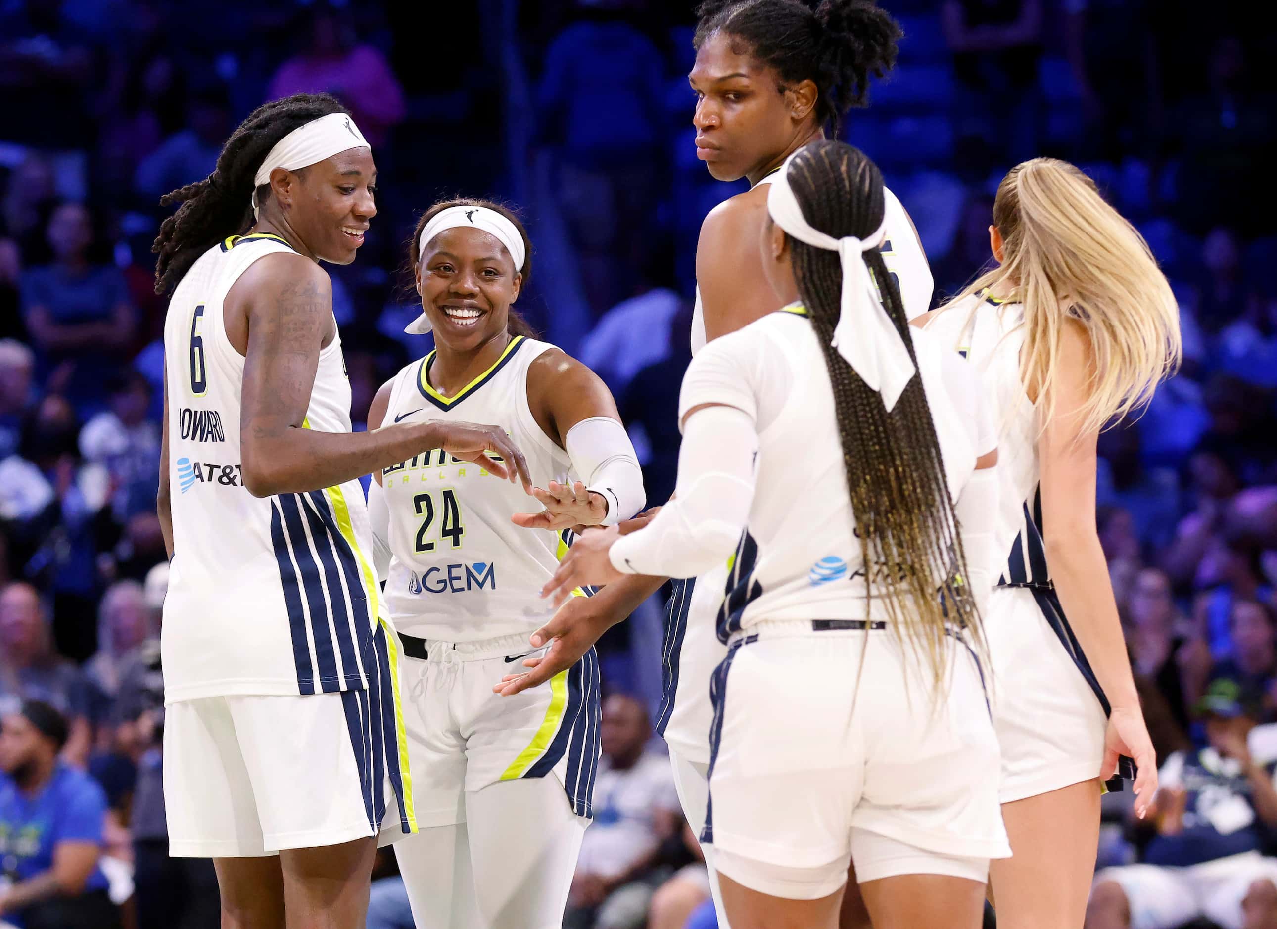 Dallas Wings guard Arike Ogunbowale (24) and her teammates celebrate during a late second...