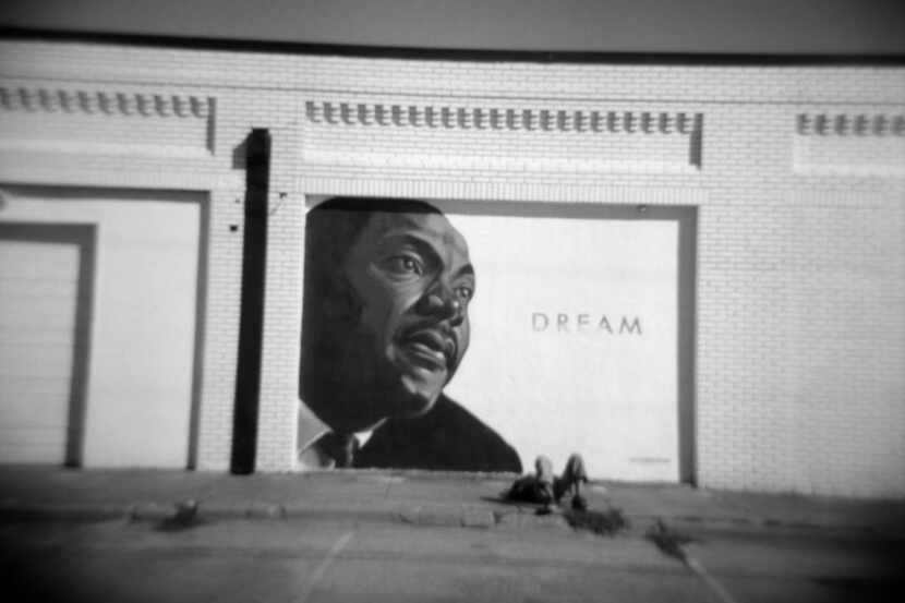 Dream, a mural depicting Martin Luther King Jr., is on the side of a building on Meadow St....