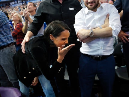 FILE - Jessica Nowitzki blows Dirk a kiss after he surpassed the 30,000-point mark against...