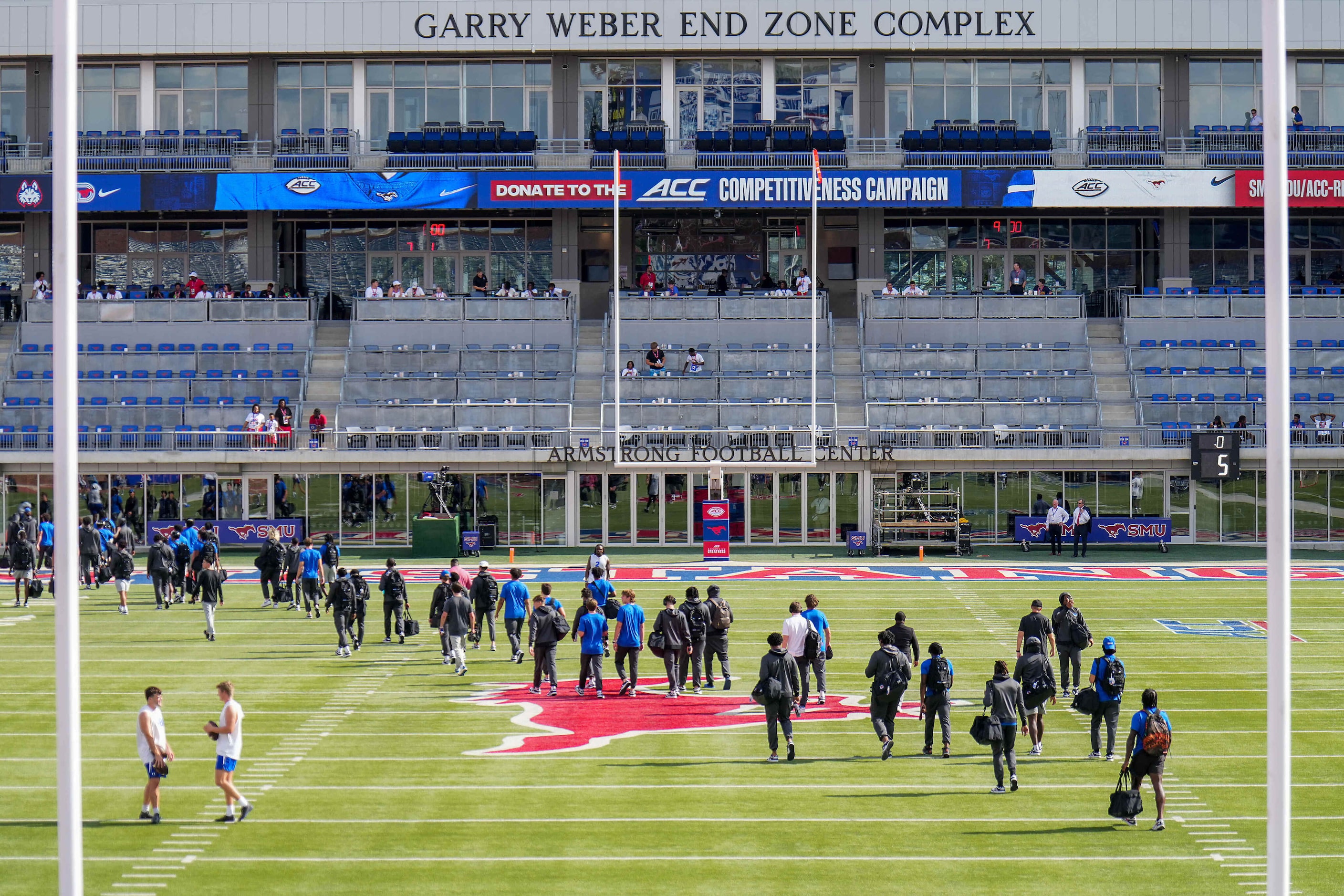 SMU players walk across the field toward the brand new Garry Weber End Zone Complex at...