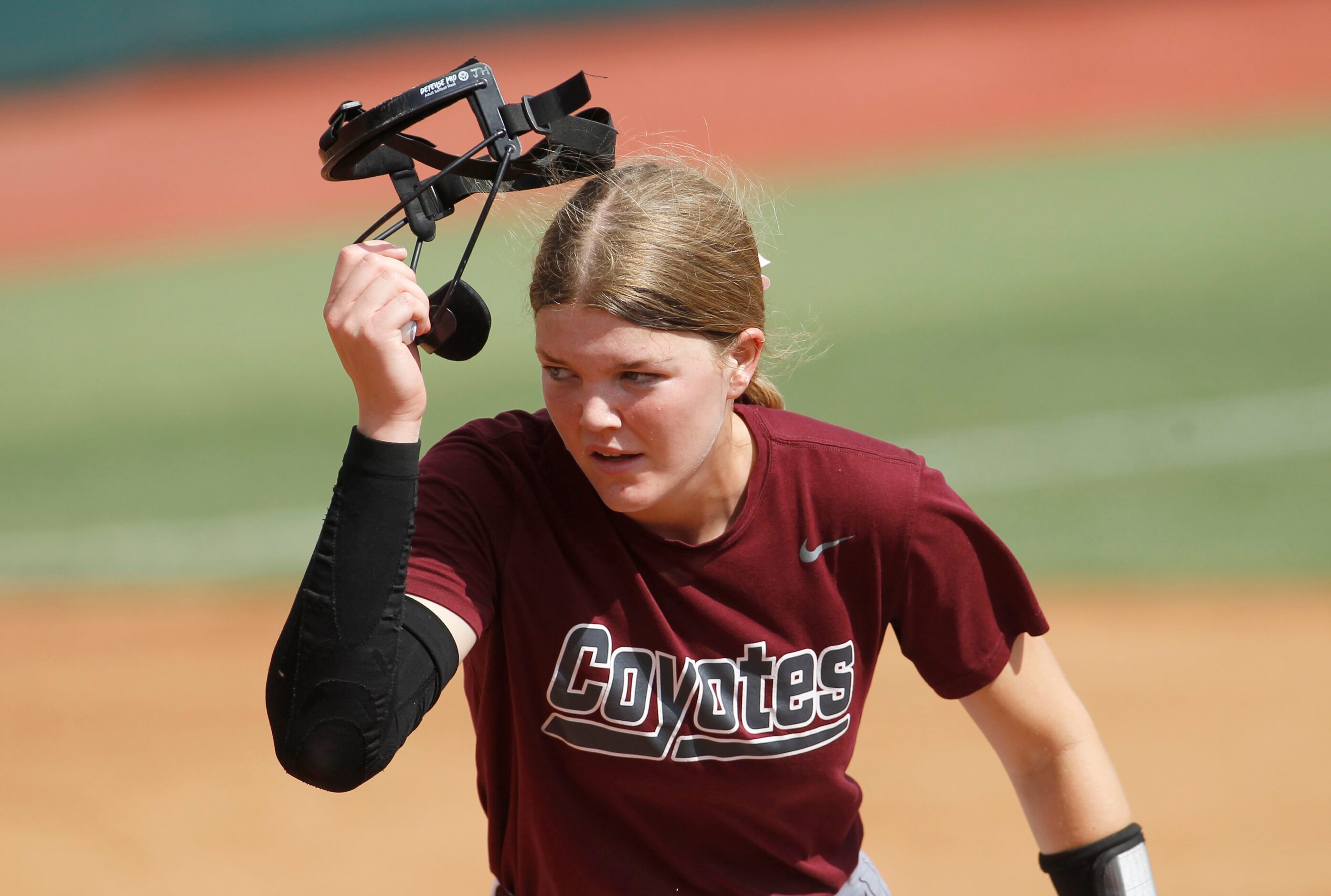 Frisco Heritage pitcher Jensin Hall (51) removes her head protector after retiring the last...