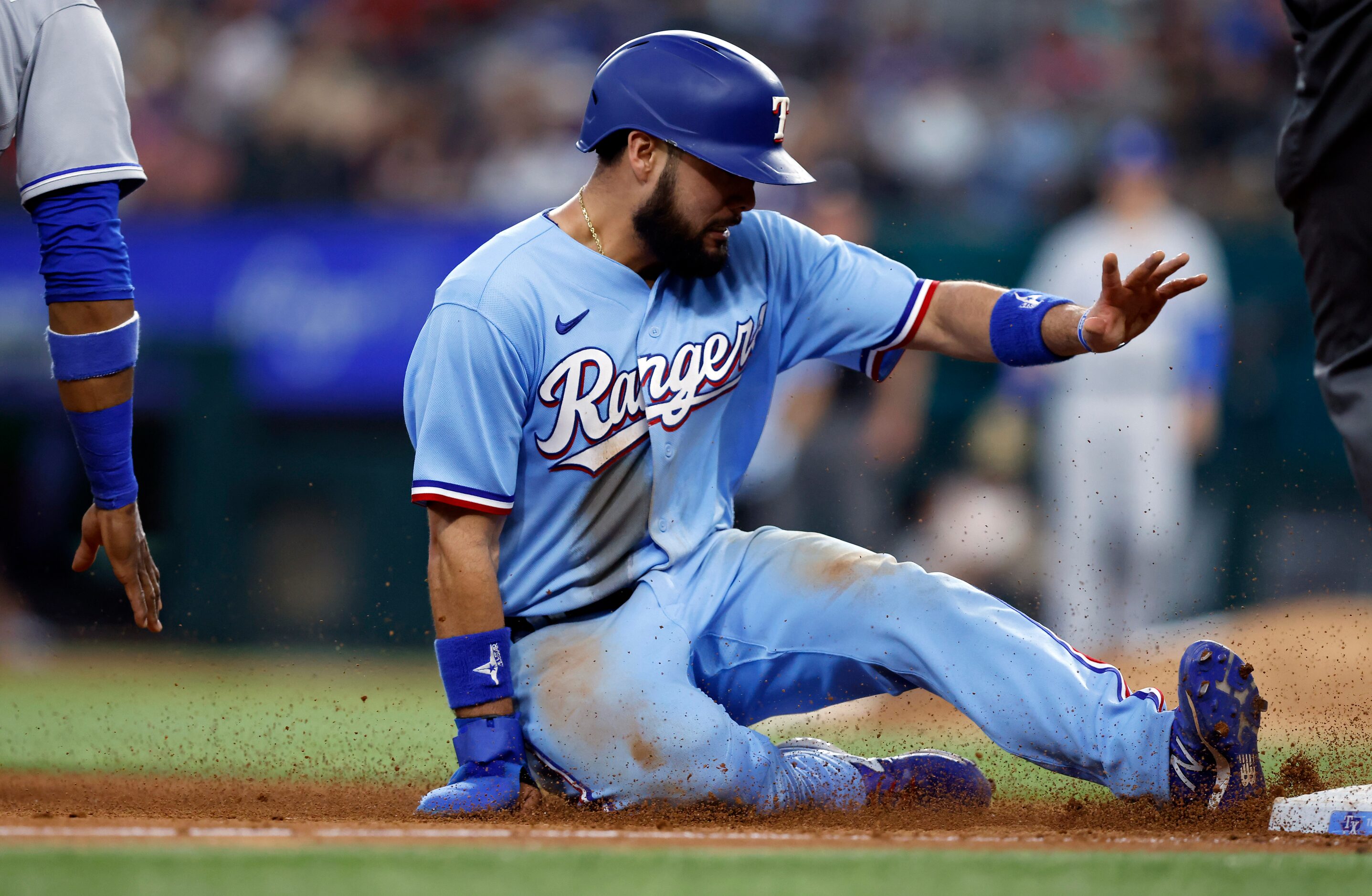 Texas Rangers Isiah Kiner-Falefa (9) is safe at third on a hit by Nate Lowe against the...