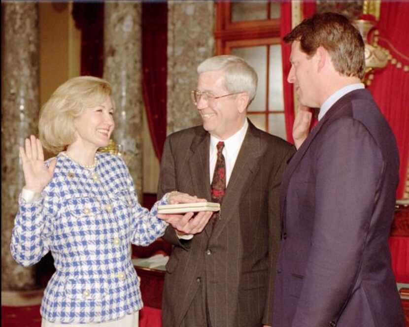 
Ray Hutchison held the Bible as his wife, Kay Bailey Hutchison, was sworn in as Texas’...