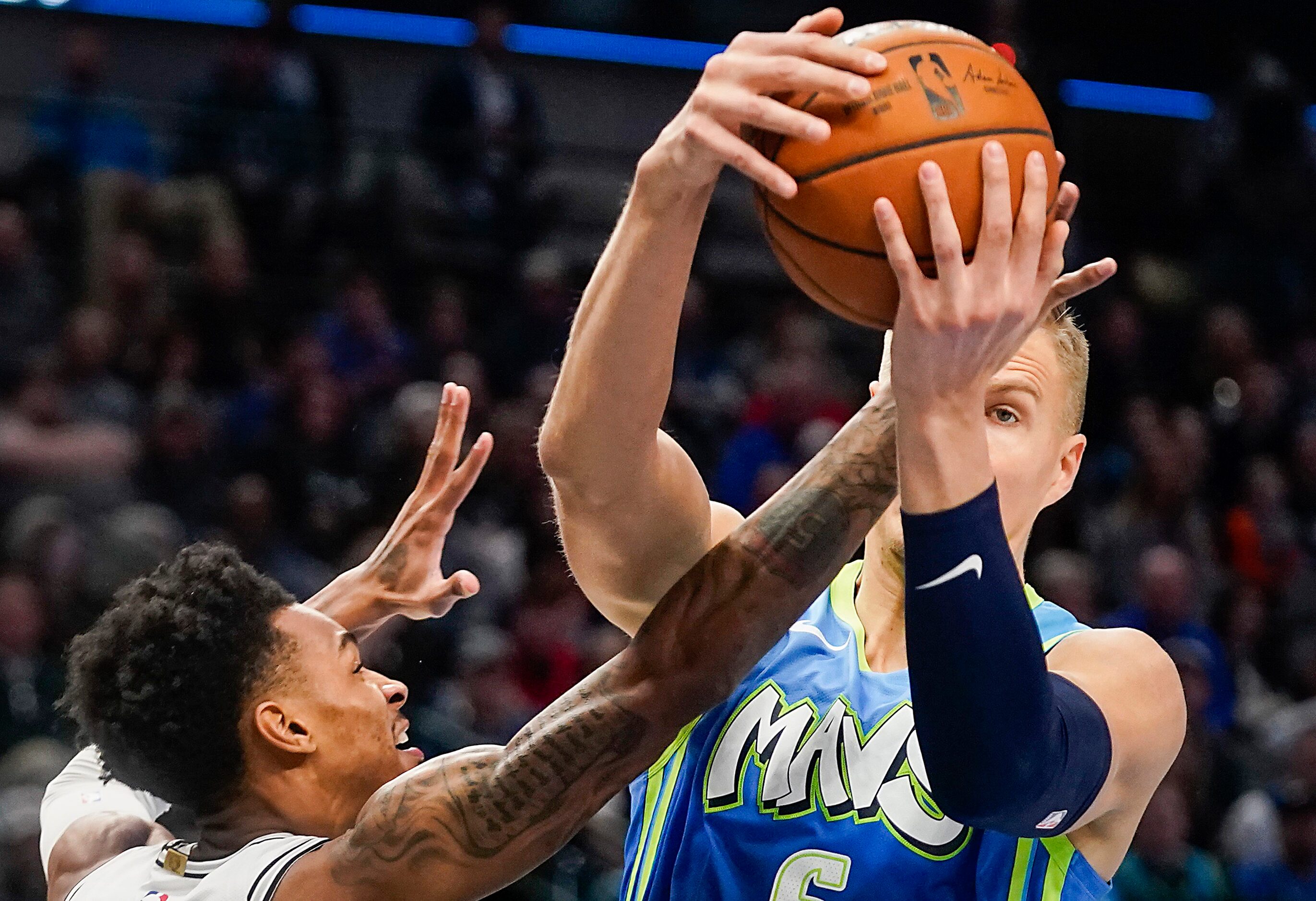 Dallas Mavericks forward Kristaps Porzingis (6) grabs a rebound from San Antonio Spurs guard...