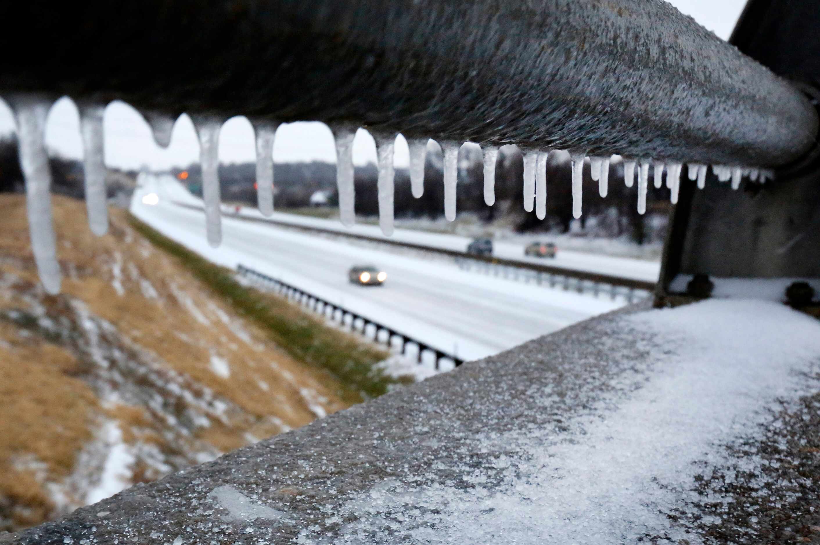 Freezing rain overnight created icicles on a bridge crossing Interstate 30 in East Fort...