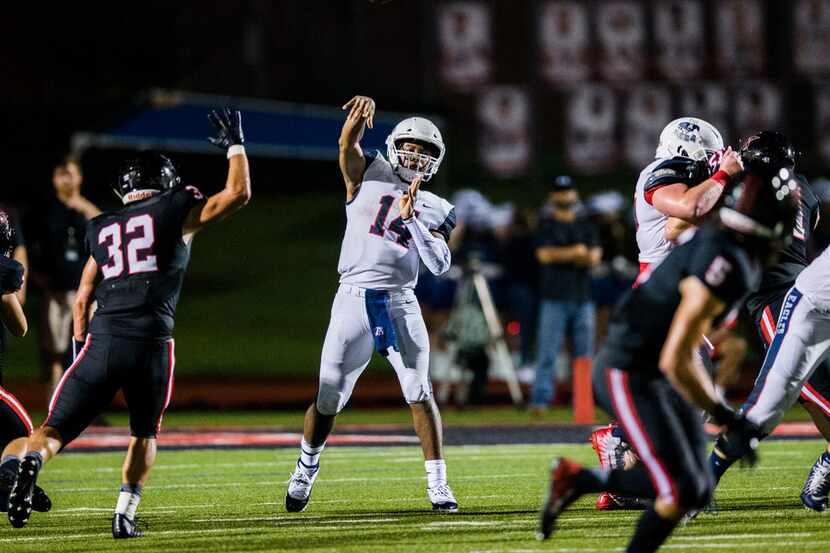 Allen quarterback Grant Tisdale (14) throws a pass during the second quarter of a high...