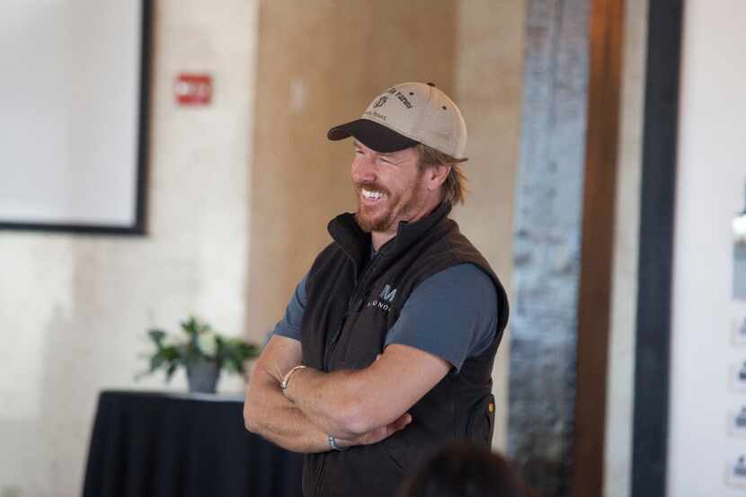 Chip Gaines demonstrates their new paint products at the Phoenix Ballroom to reporters...