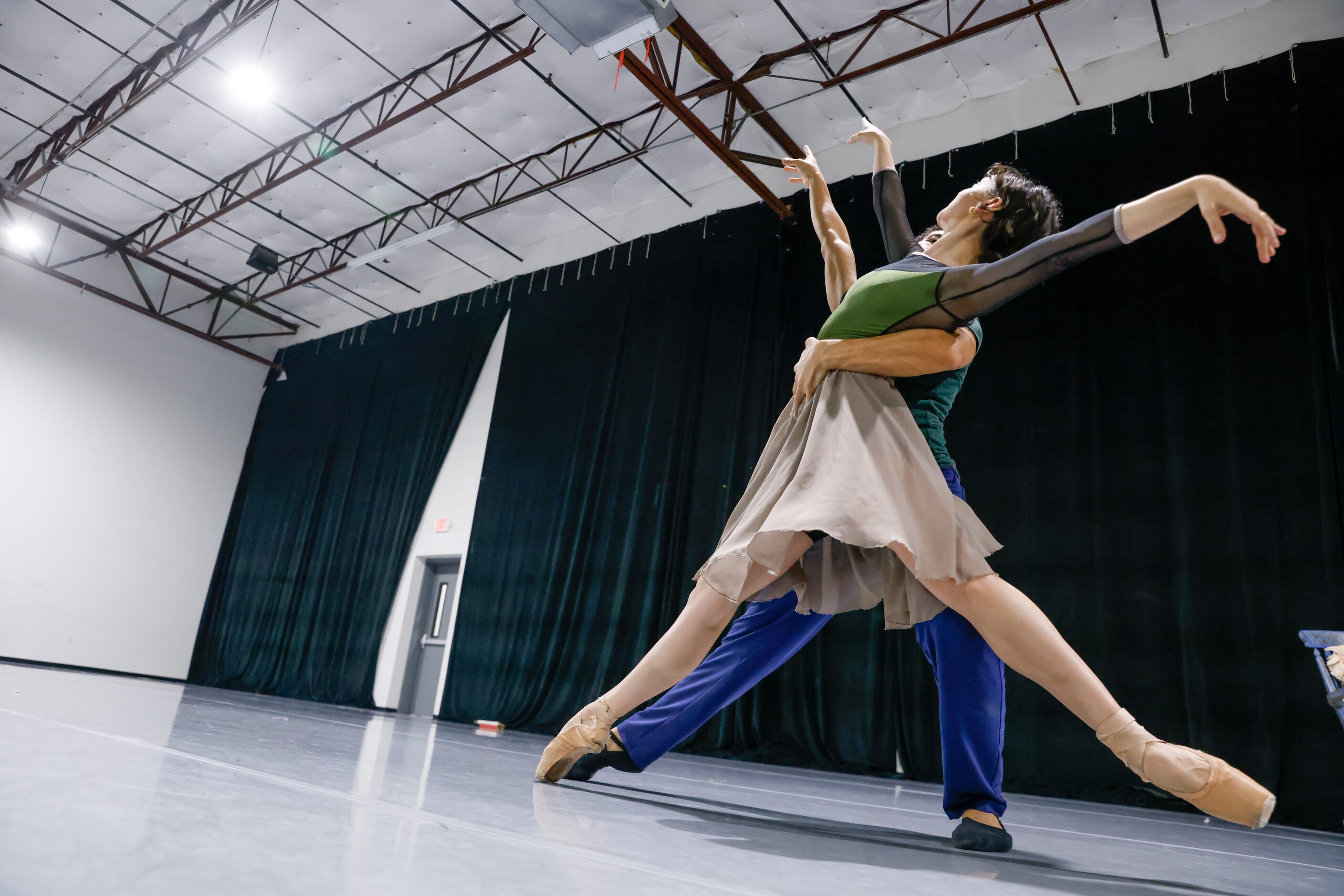 Alexandra F. Light (right) moves across the room with Joamanuel Velazquez as they rehearse a...