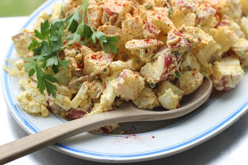 Signed up for  deviled eggs and the potato salad for the potluck? Combine the two summertime...