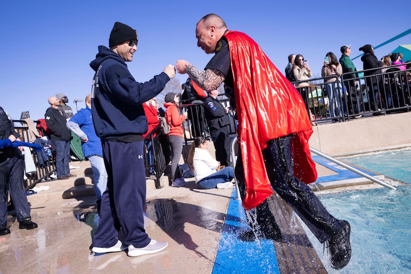 Richard Foy, deputy chief with the Dallas Police Department, fist-bumped Chief Eddie García...