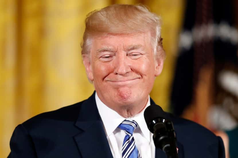 President Donald Trump smiles in the East Room of the White House in Washington, Tuesday,...