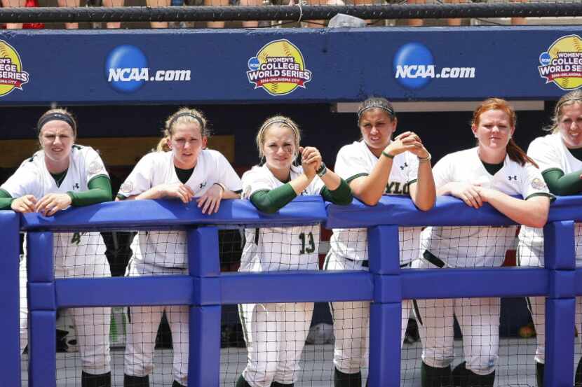 Baylor dugout watches Florida at bat during the sixth inning of an NCAA women's softball...