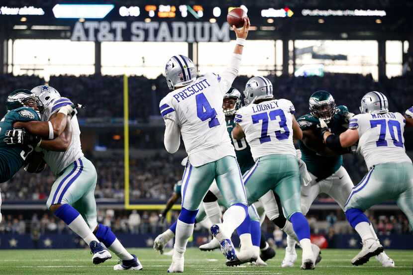 Dallas Cowboys quarterback Dak Prescott (4) throws a third quarter interception to...
