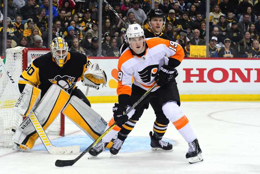 PITTSBURGH, PA - MARCH 25: Nolan Patrick #19 of the Philadelphia Flyers fights for position...