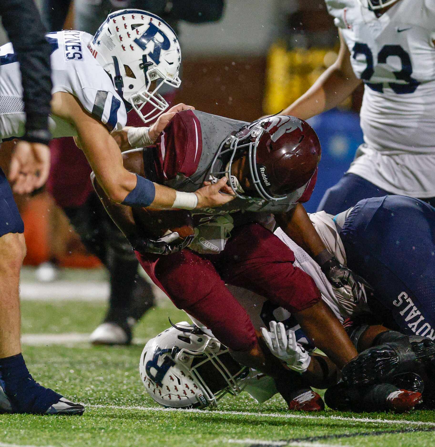 Richland defensive back Gavin Jaynes (19) pulls Mansfield Timberview running back Javelin...