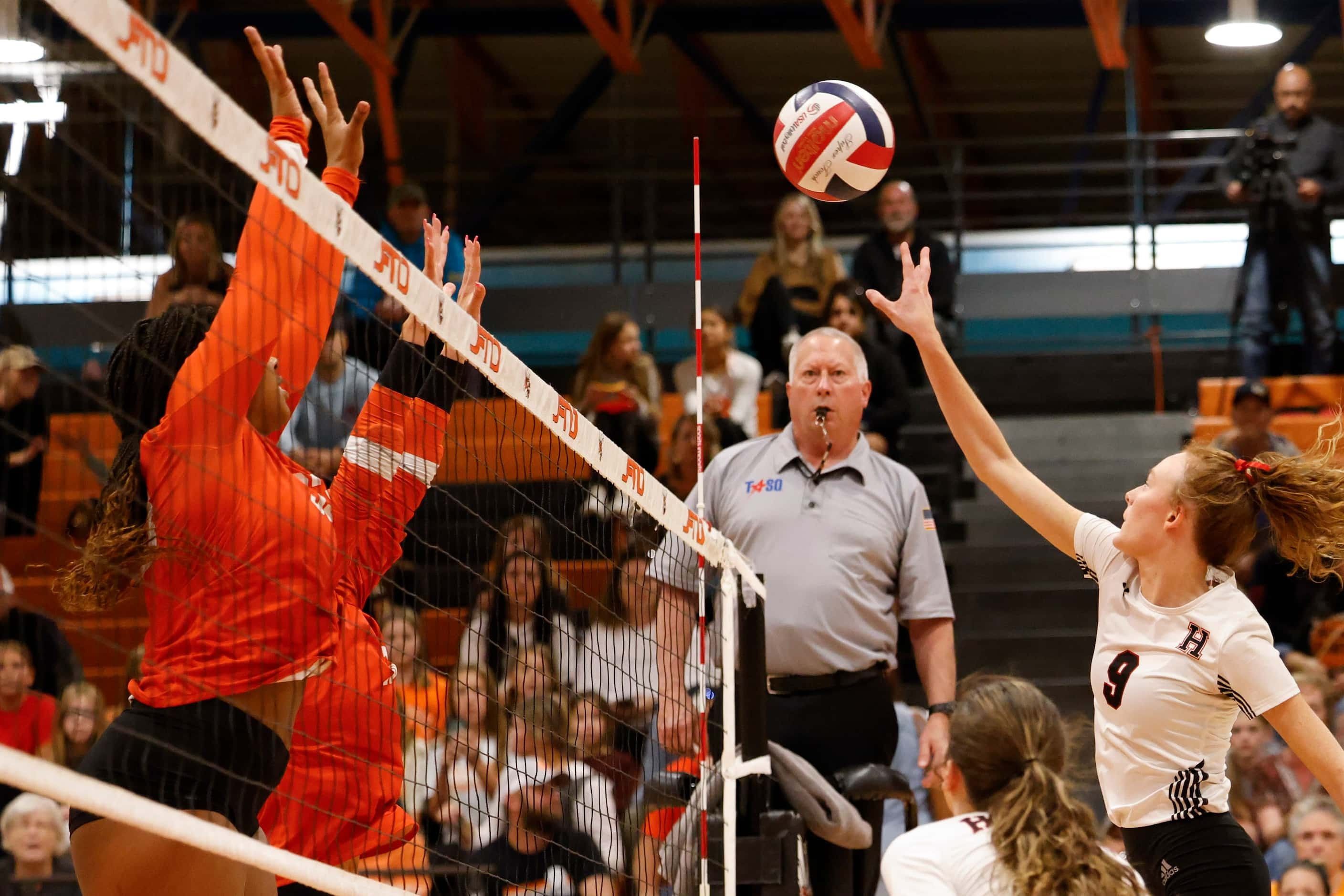 Rockwall heath’s Presley McGriff (right) spikes the ball during a volleyball game against...