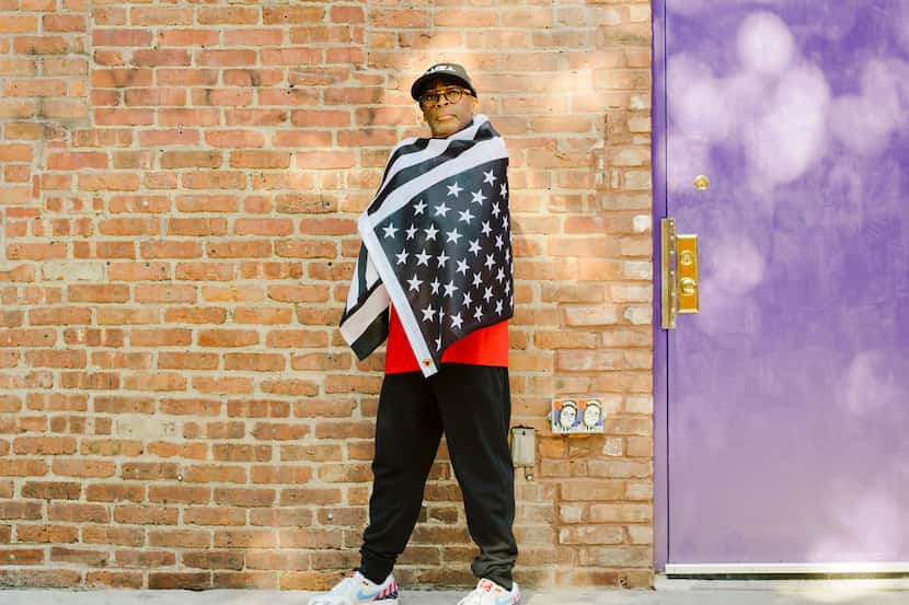 Director Spike Lee drapes himself in an upside-down, black-and-white American flag in New...