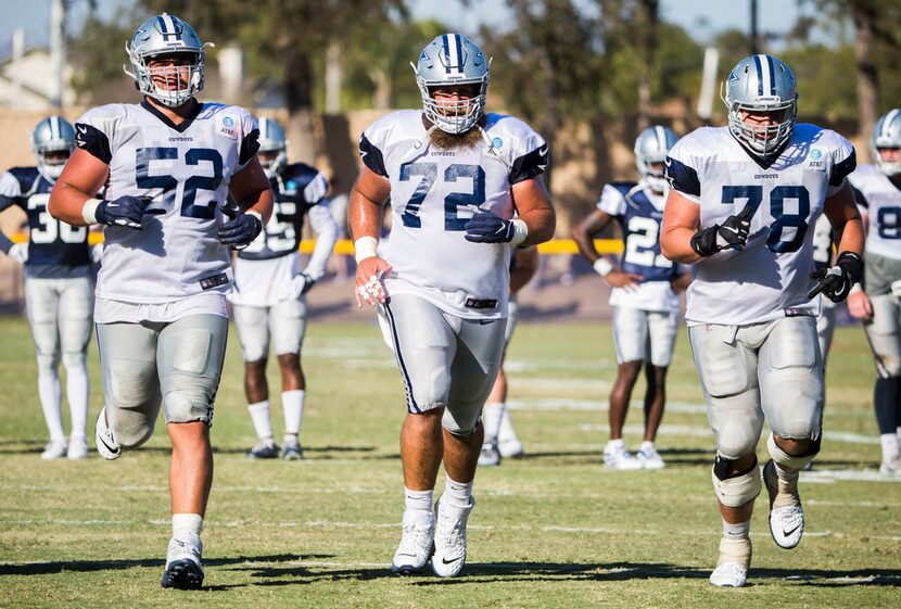 Dallas Cowboys offensive guard Connor Williams (52), center Travis Frederick (72) and...