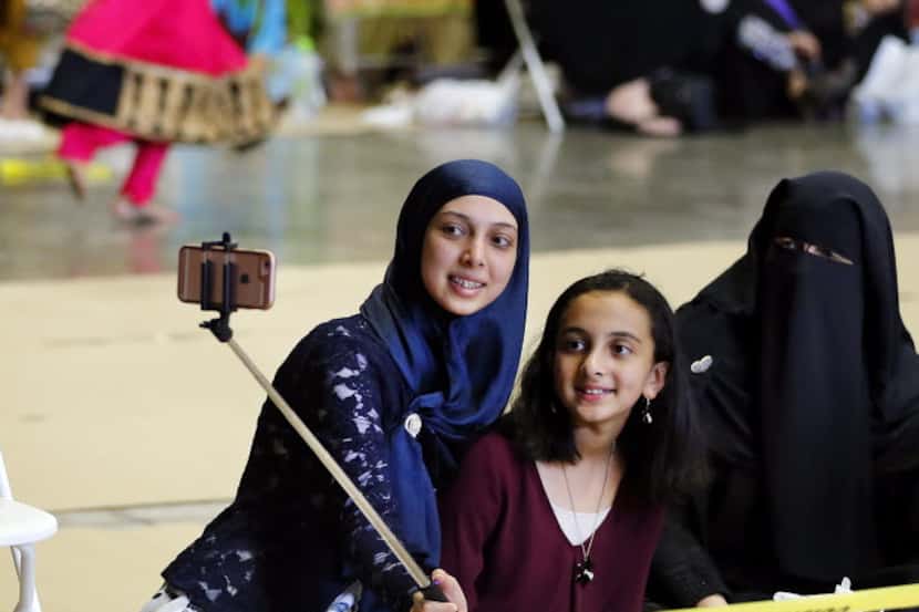 Sisters Alshaimaa Salama (left) and Hasnaa Salama of McKinney took a picture with their...