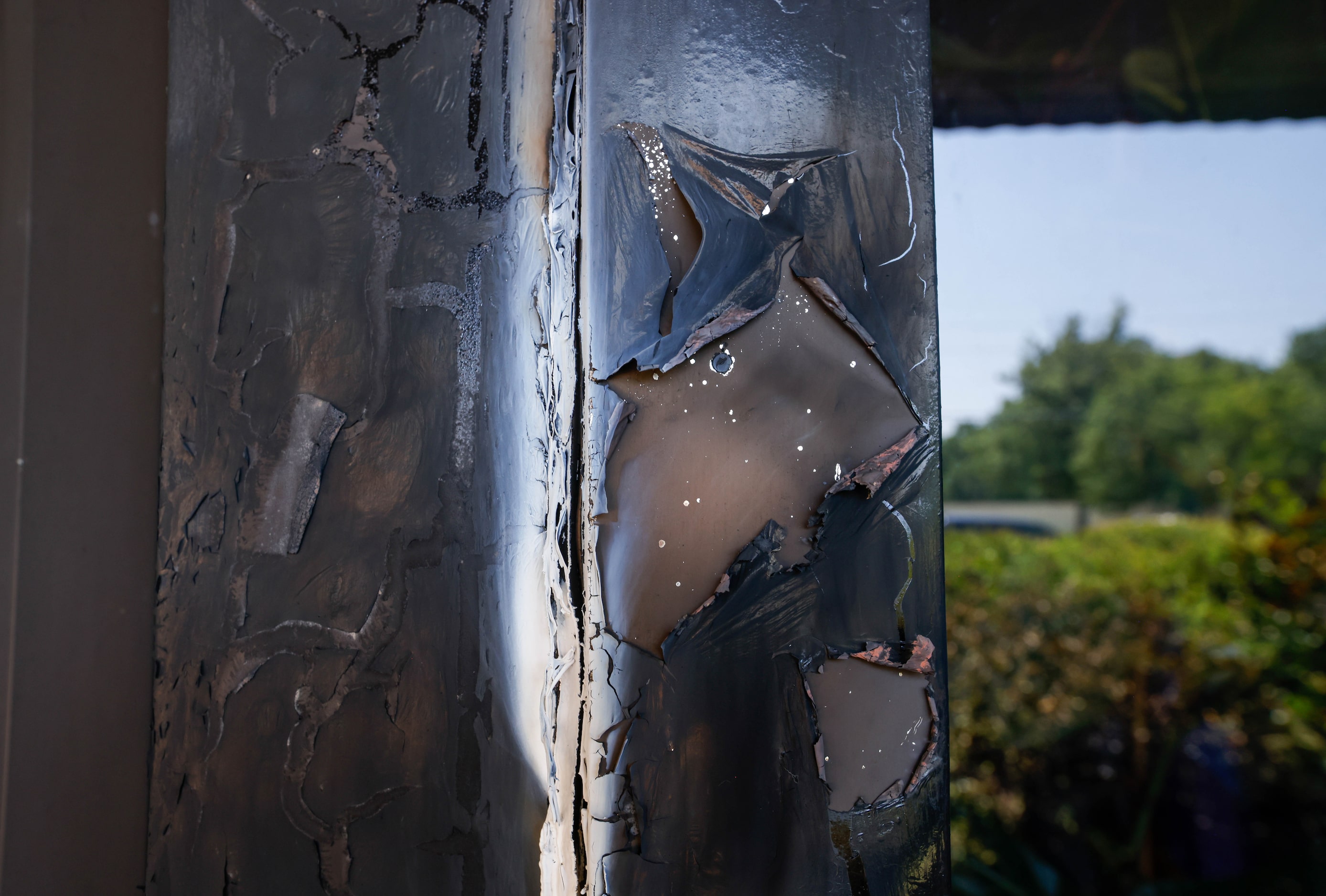 Damage to the doorway of Community Unitarian Universalist Church of Plano is visible on...