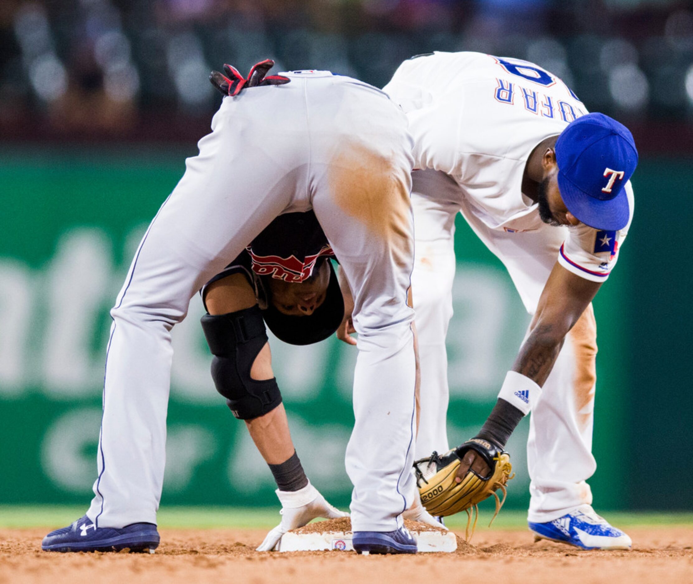 Texas Rangers first baseman Jurickson Profar (19) and Cleveland Indians second baseman Erik...