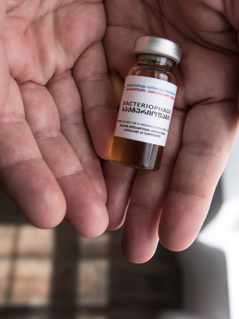 Patti Swearingen holds a vial of bacteriophages that cured her antibiotic-resistant...