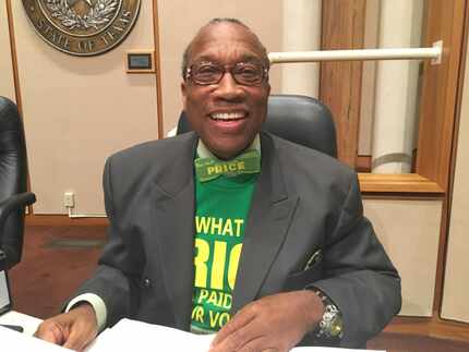 Dallas County Commissioner John Wiley Price, wearing one of his signature bowties that reads...