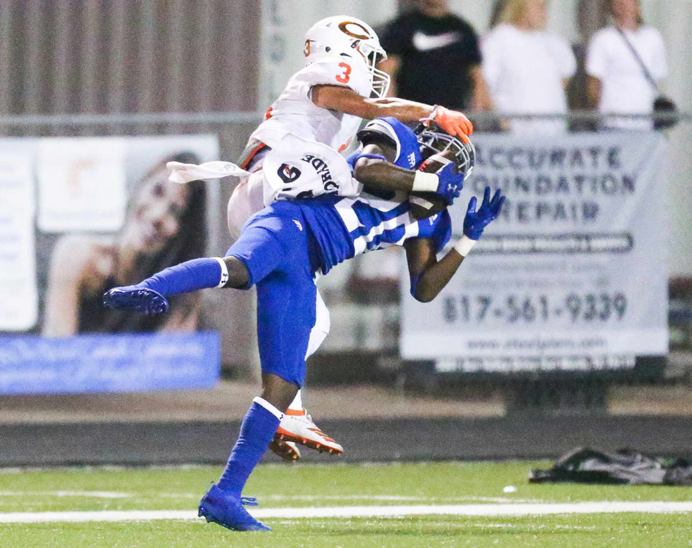 Nolan Catholic defensive back Keontae Williams (20) intercepts a pass intended for Celina...