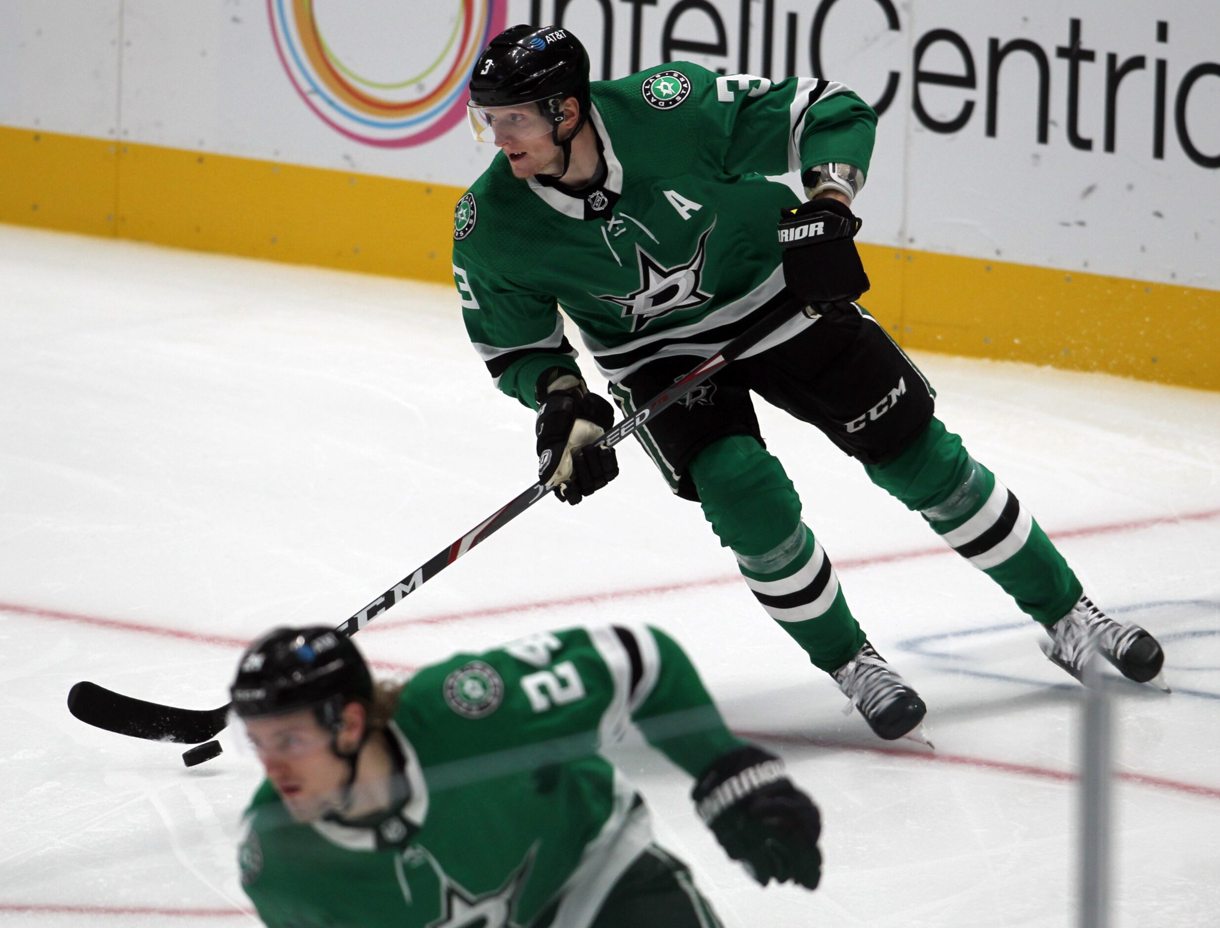 Dallas Stars defenseman John Klingberg (3) moves the puck from behind the Stars goal during...