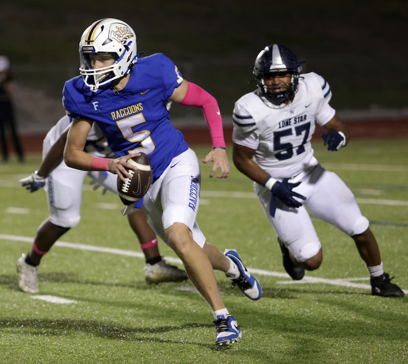 Frisco player #5 Cobyn Harbert tries to avoid being tackled during the Frisco Lone Star High...