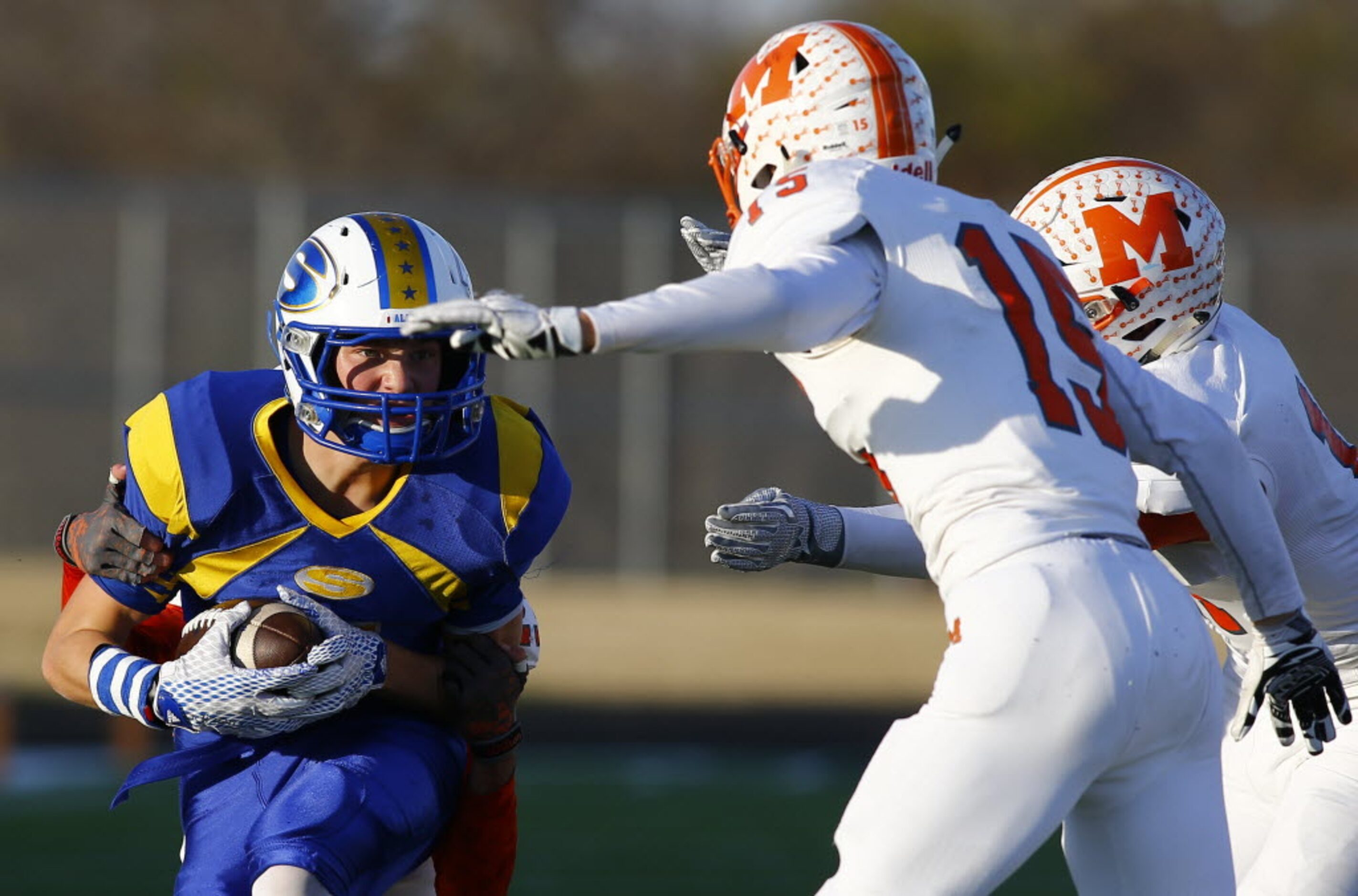 TXHSFB Sunnyvale's Cash Goodhart (5) is tackled by Mineola's Devon Goguen (23) and Cameron...