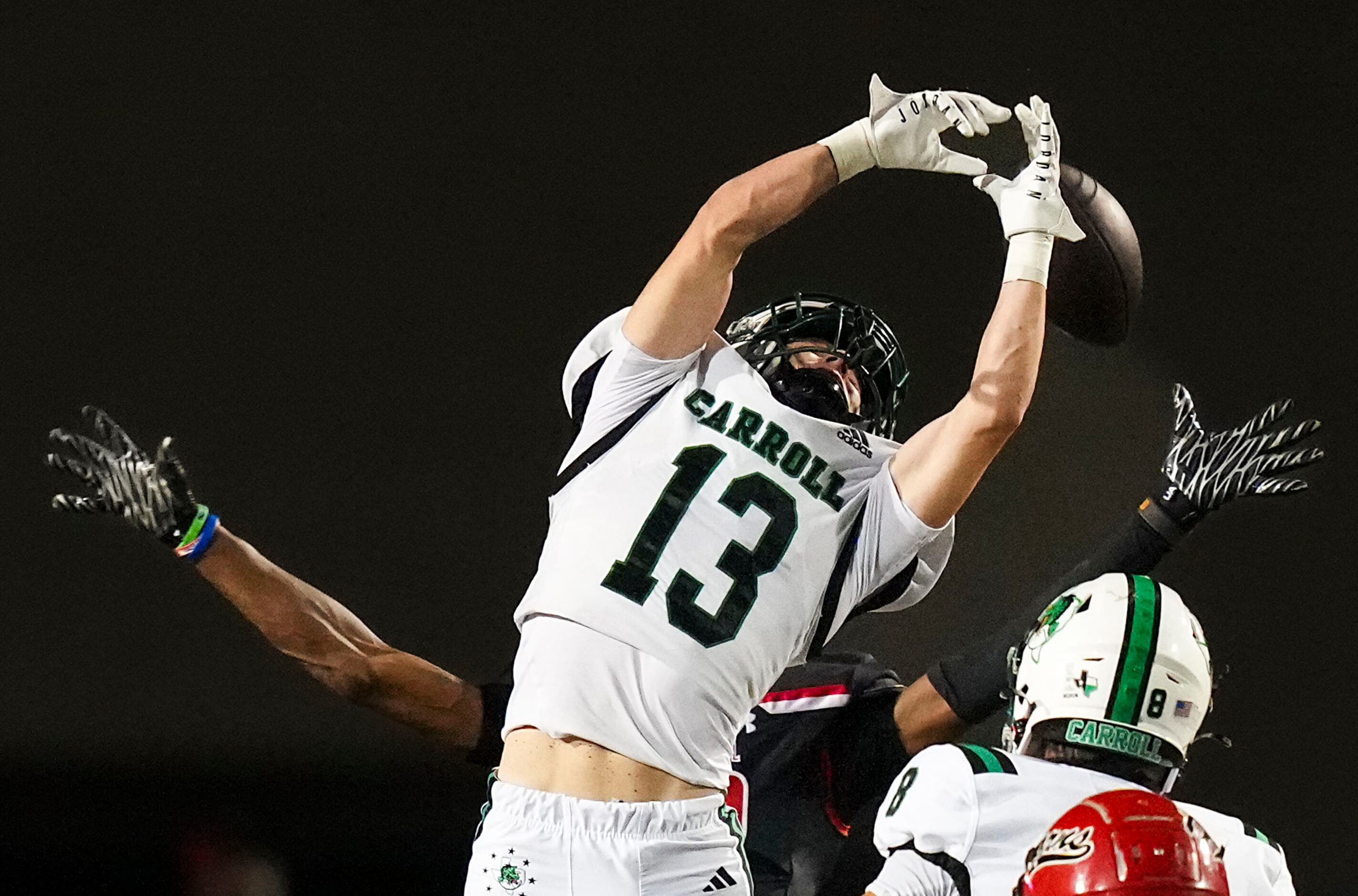 Southlake Carroll defensive back Trey Ferri (13) breaks up a pass intended for Cedar Hill...