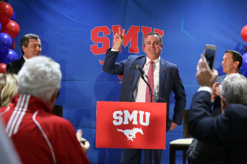 New SMU head football coach Sonny Dykes is applauded after his introduction in Dallas,...