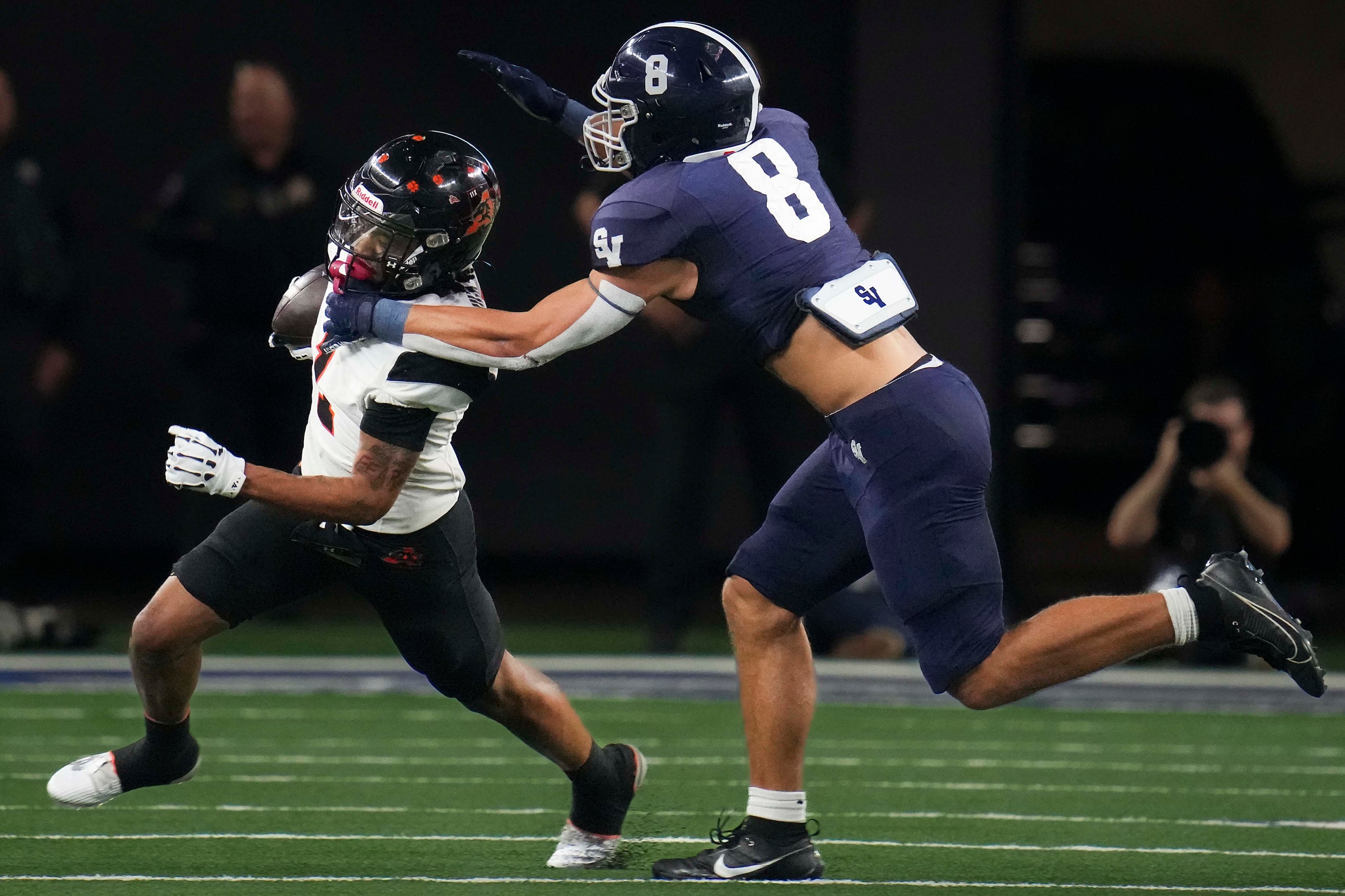 Aledo's Hawk Patrick-Daniels (1) tries to get past Comal Smithson Valley defensive back Zach...