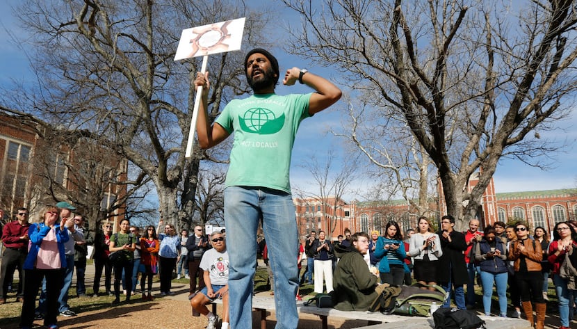 Indian student Gnana Subramaniam speaks to a crowd during a "Rally for Diversity" on the...