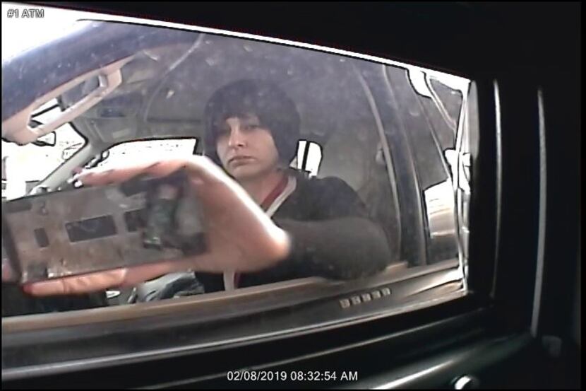 Surveillance footage showed a woman apparently installing a skimming device on an ATM in...