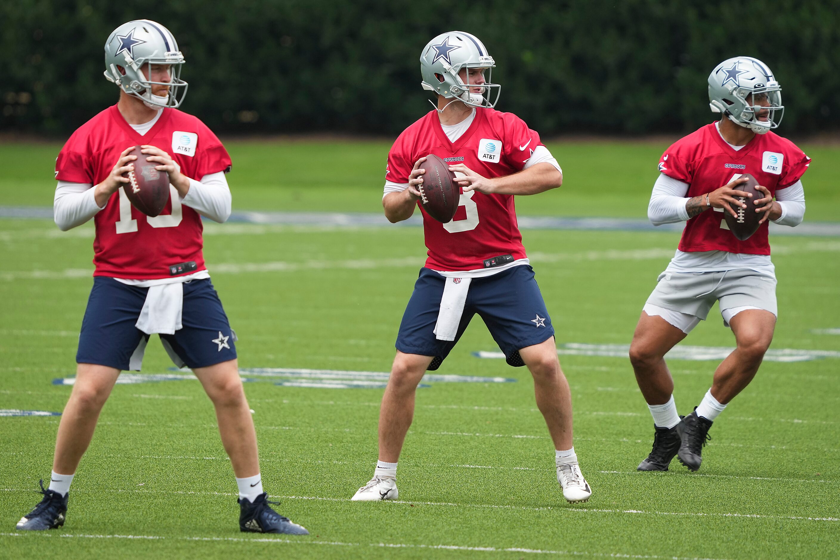 Dallas Cowboys quarterbacks, from left, Cooper Rush, Garrett Gilbert and Dak Prescott...