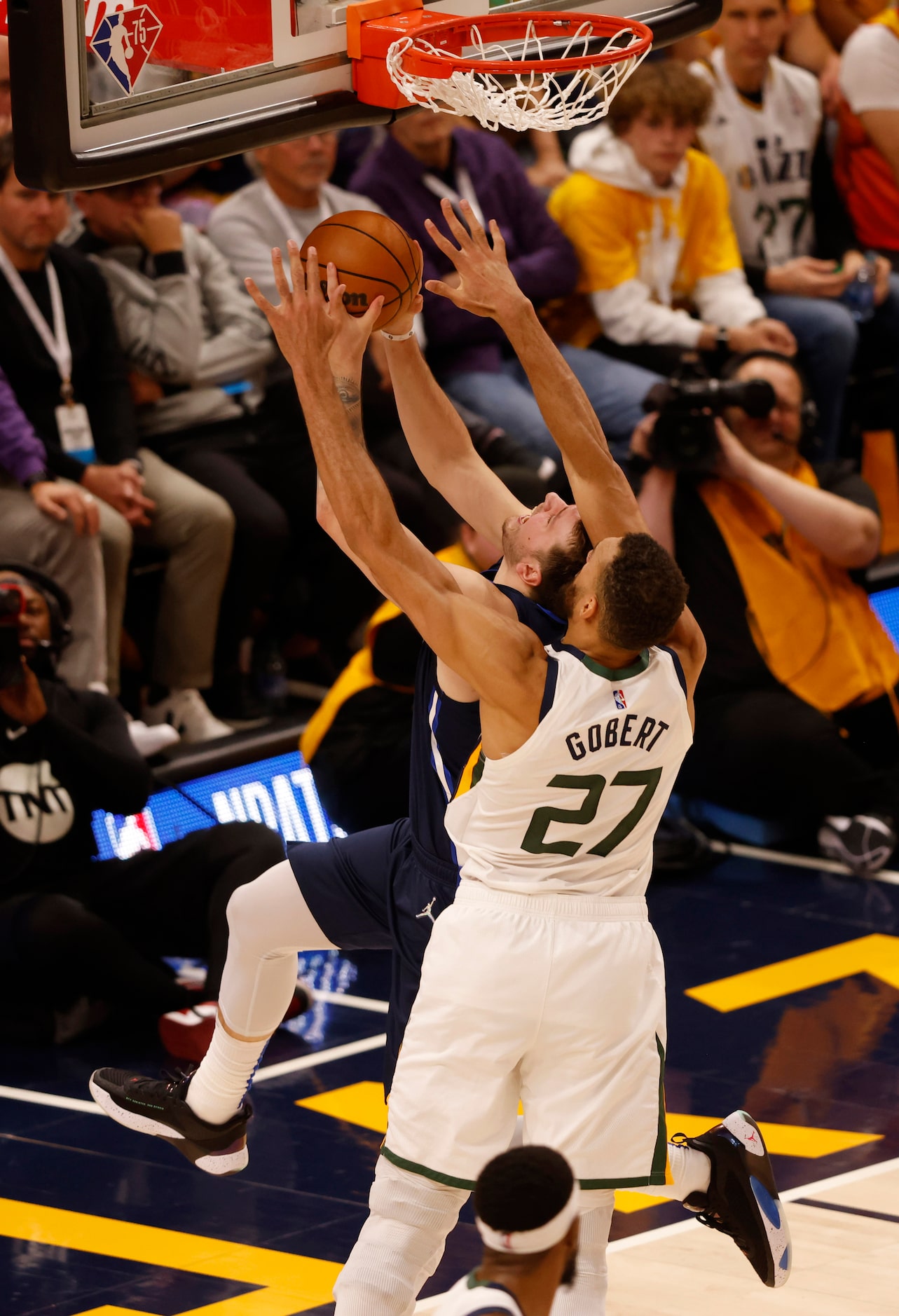 Dallas Mavericks guard Luka Doncic (77) is fouled by Utah Jazz center Rudy Gobert (27) on a...