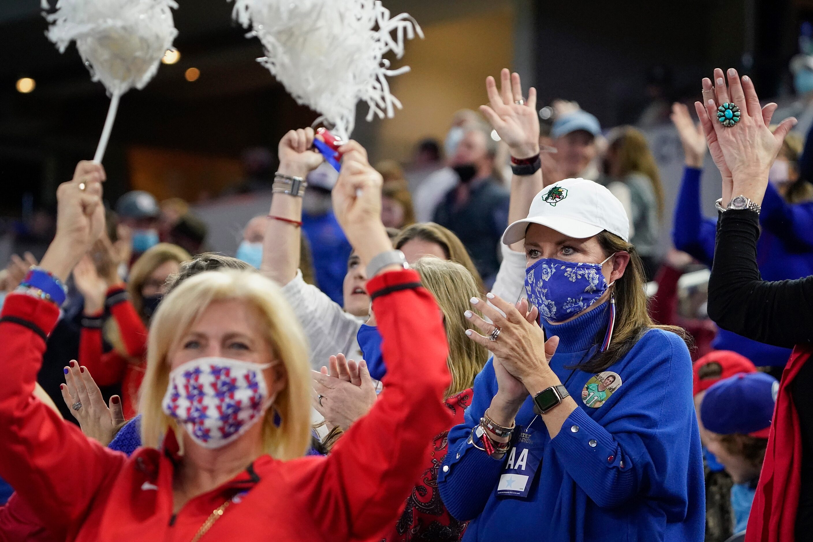 Elizabeth Dodge cheers a Westlake touchdown in the team section while wearing the team...