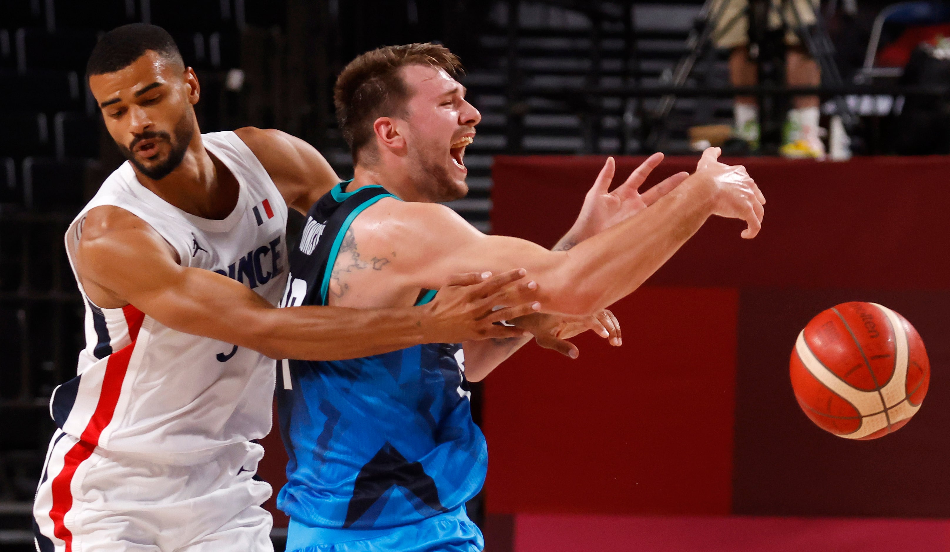 Slovenia’s Luka Doncic (77) is fouled by France’s Timothe Luwawu Cabarrot (3) during the...