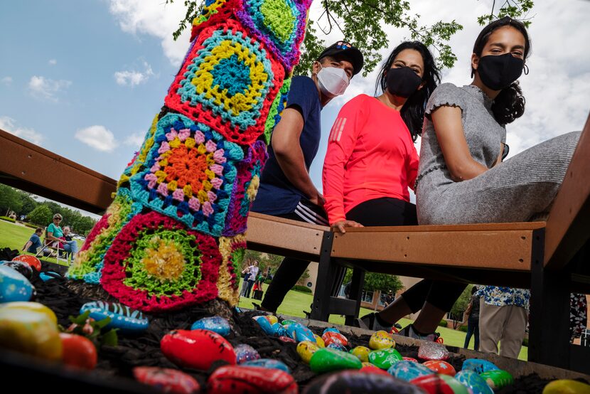 Anya Ali (right) sits with her mother, Anjum Gilani, and father, Ameen Ali, at her Girl...