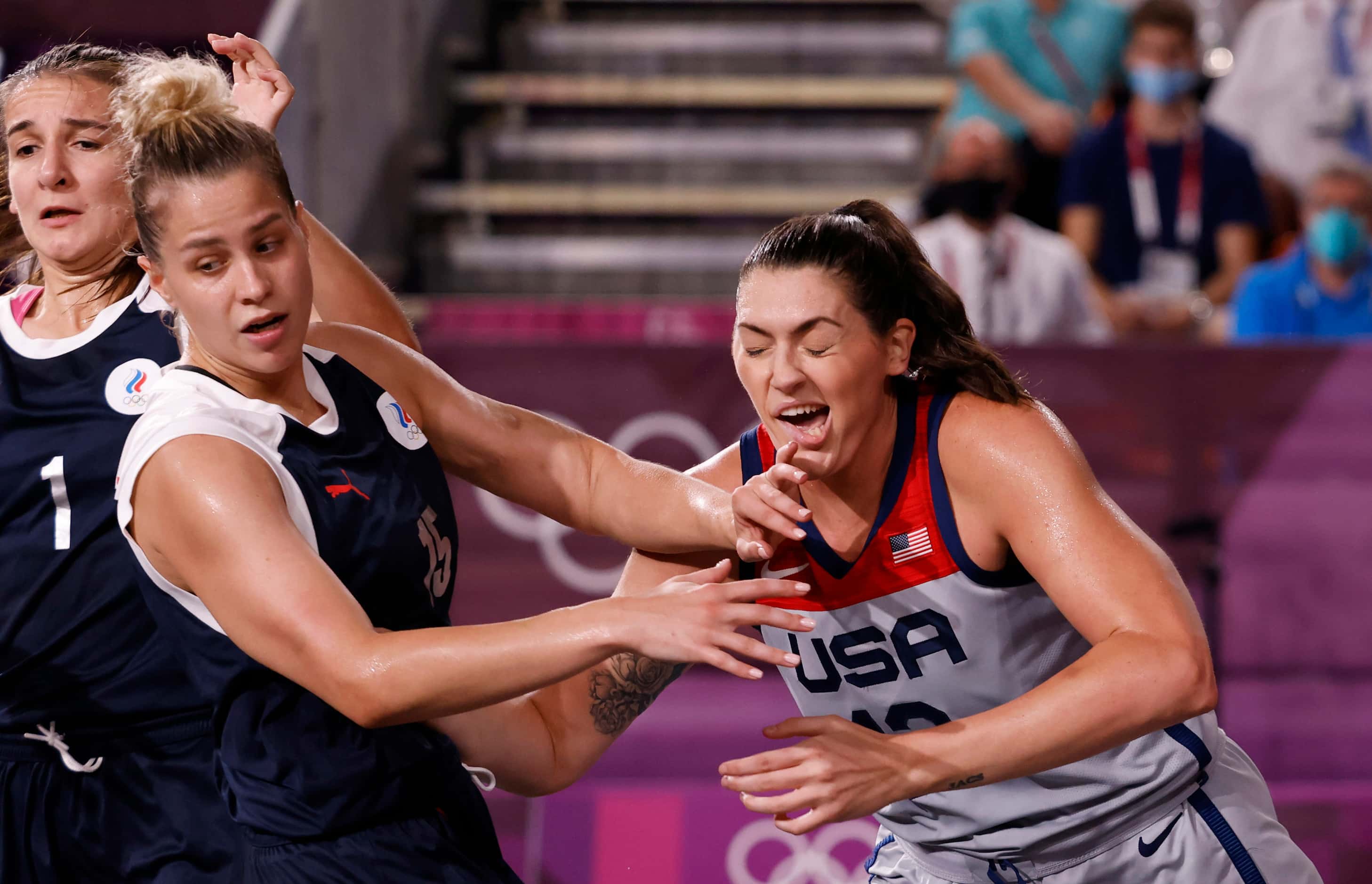 USA’s Stefanie Dolson (13) is hit in the face by ROC’s Olga Frolkina (15) on a play during...