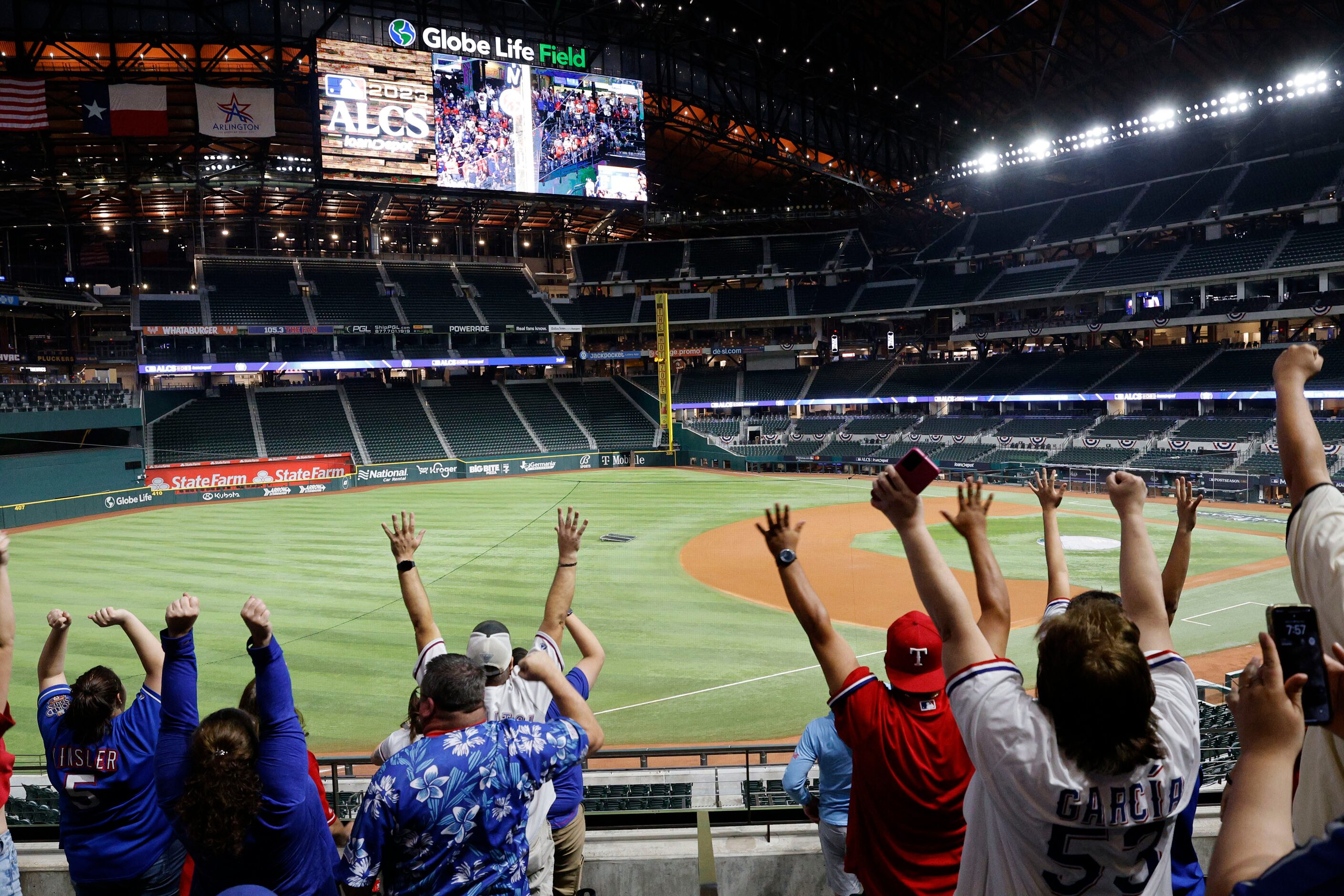 Texas Rangers fans react during a Game 7 watch party of the baseball American League...