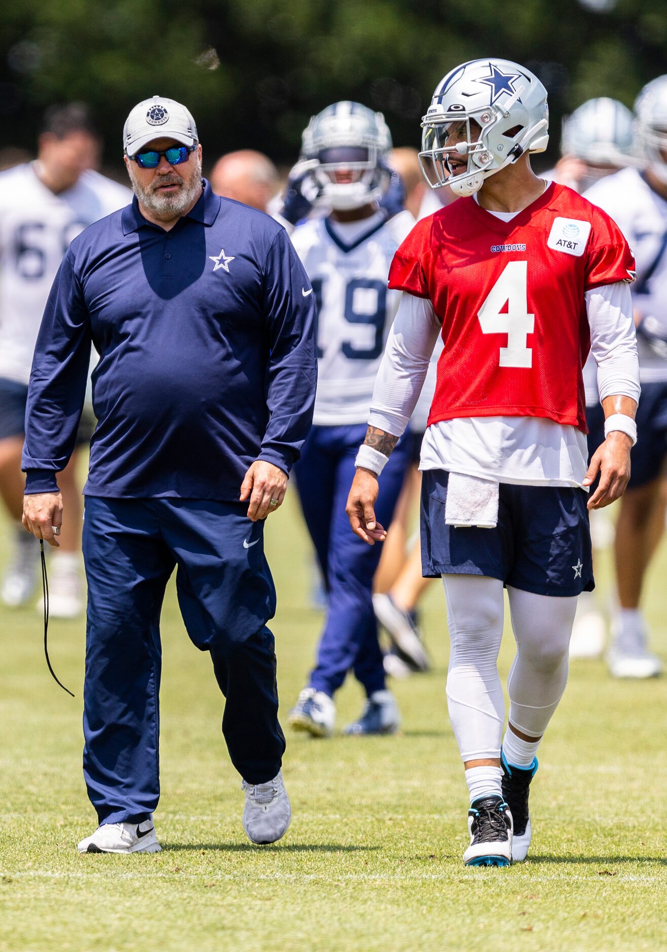 Dallas Cowboys head coach Mike McCarthy, left, and quarterback Dak Prescott (4) are seen...