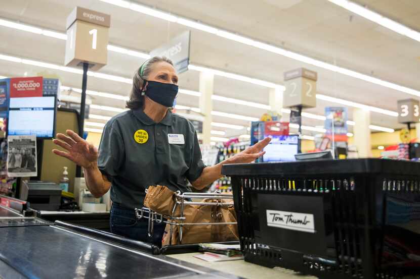 Lou Dalton on the job last Wednesday as a checkout clerk at the Arapaho Village Tom Thumb...