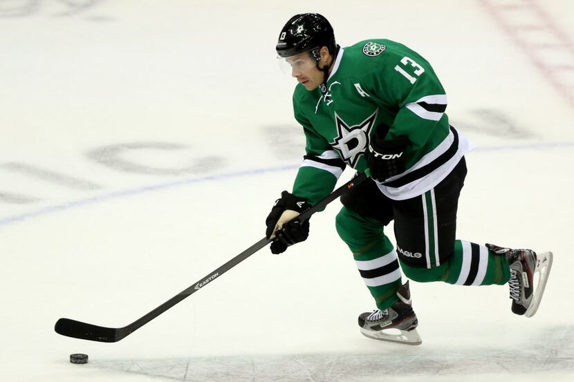 In this file photo, Dallas Stars left wing Ray Whitney (13) skates down the ice with the...