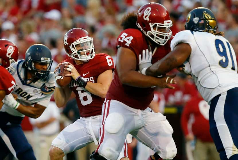 Oklahoma quarterback Baker Mayfield (6) passes under pressure in the second quarter of an...