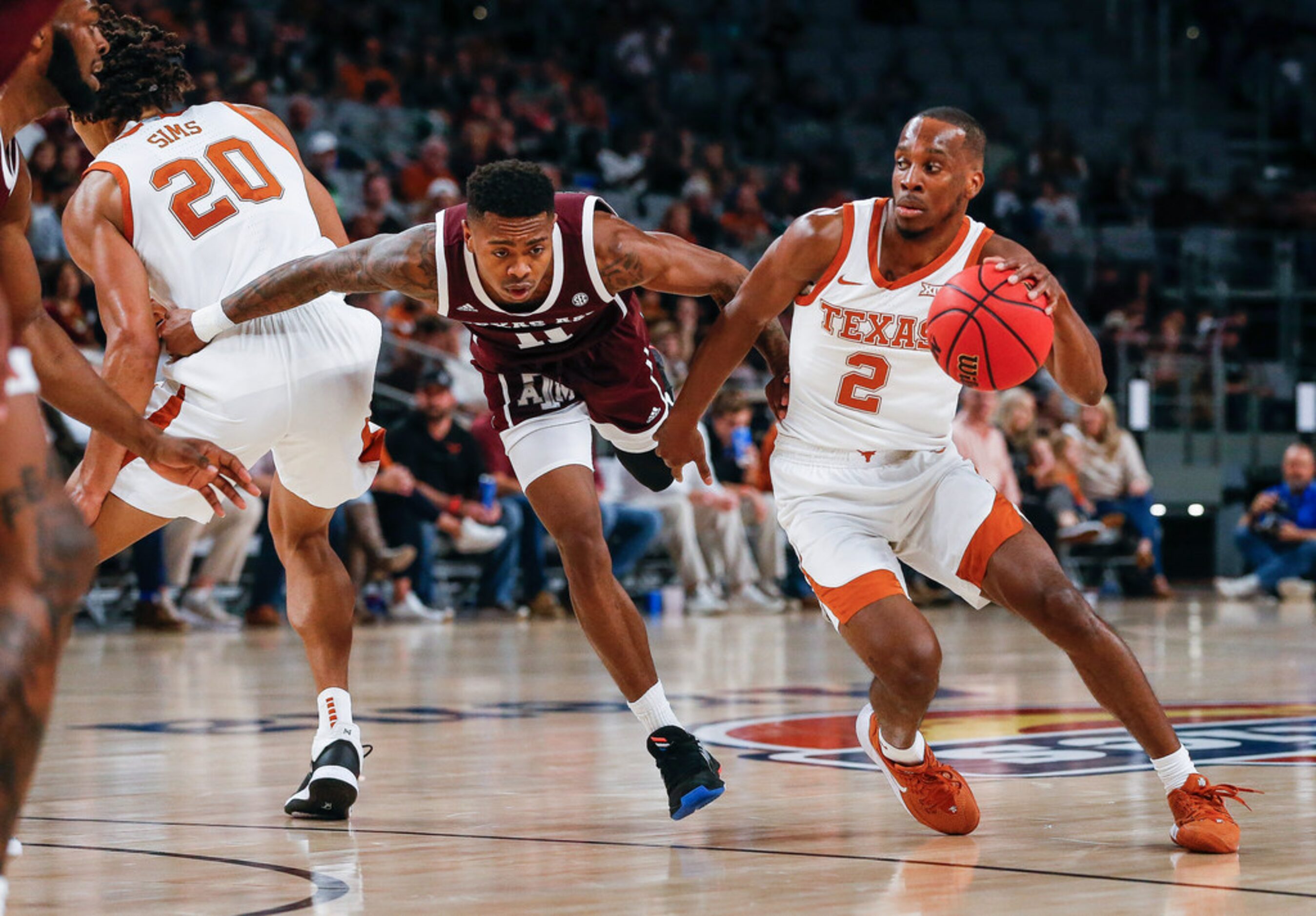 Texas Longhorns guard Matt Coleman III (2) drives past Texas A&M Aggies guard Wendell...